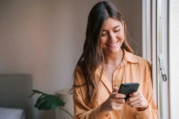 woman happy with public mobile referral code promotion